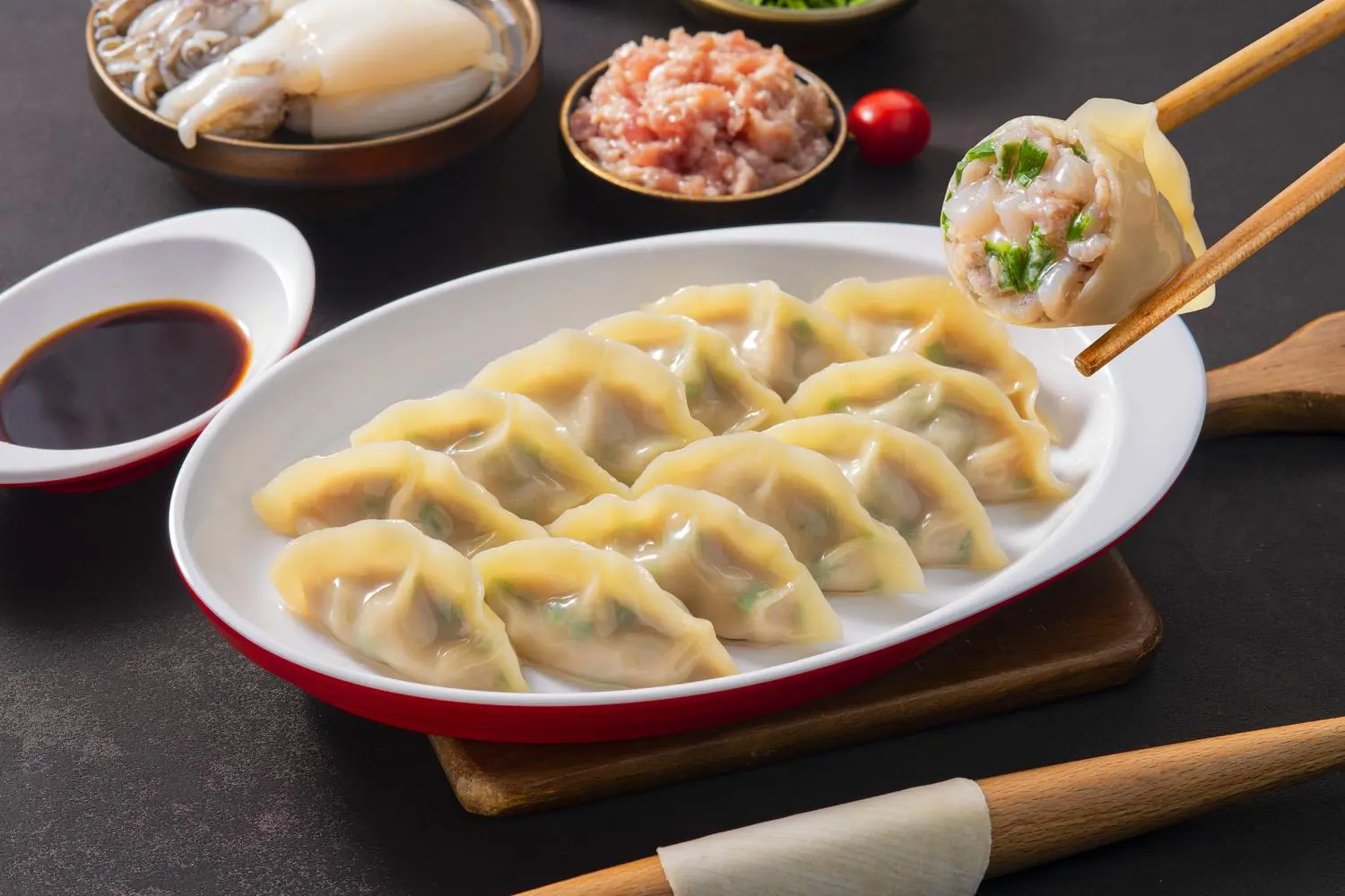 Mom’s-Dumpling-Chinese-Restaurant-Cuttlefish-Meat-Dumplings-Davis Cooked dumplings with cuttlefish and meat filling, served with soy sauce at Mom’s Dumpling, a Chinese Restaurant in Davis